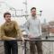 Graduate student Jared Newell, left, and Nathan Phillips on the roof of the Stone Science Building